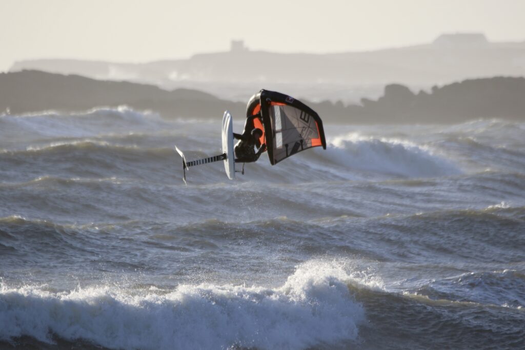 Phil Horrocks with the ENSIS SPIN jumping in waves