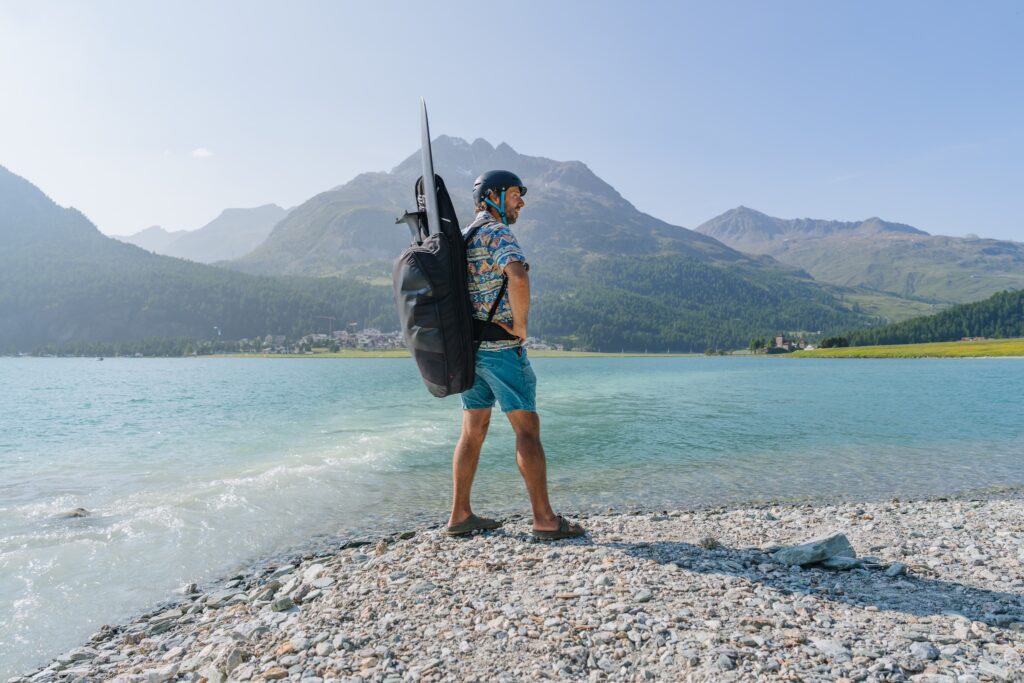 man carrying hip hop pump foiling backpack
