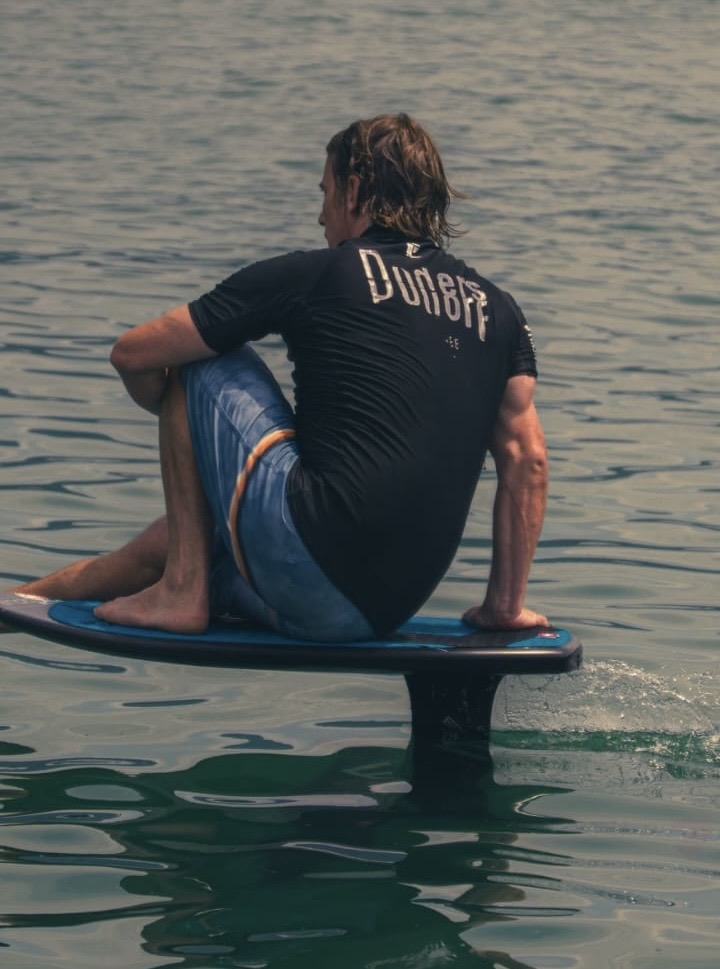 Heinar Brandstötter sat on a wing foil, gliding